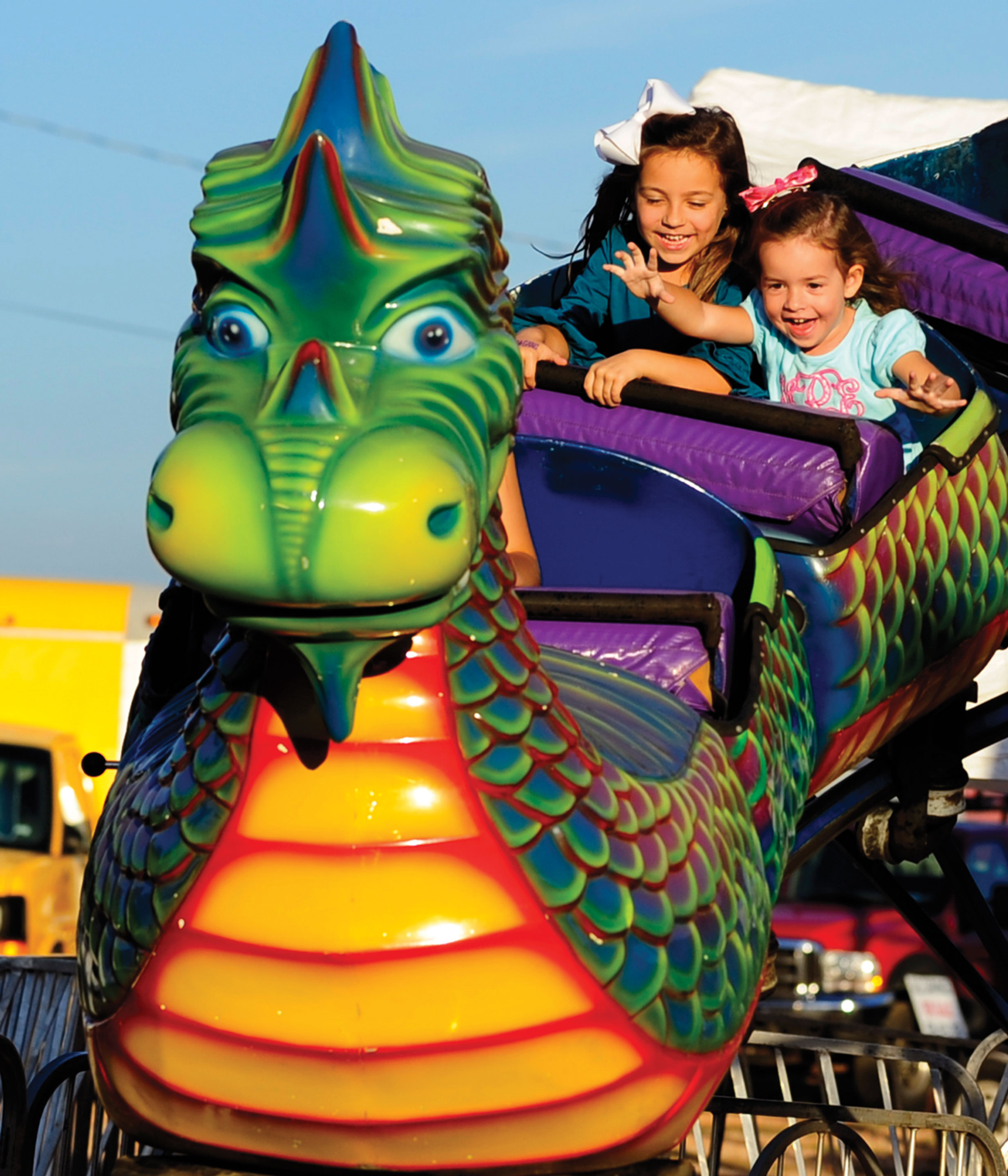 Leah-Peden-and-sister-Hanna-Peden-ride-the-dragon-roll-a-coster-ride-at-the- Lee-County-Fair | The Observer