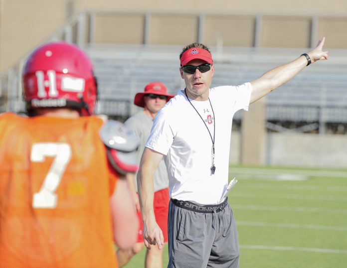 Hot day on field as Coach Ross goes thru drills