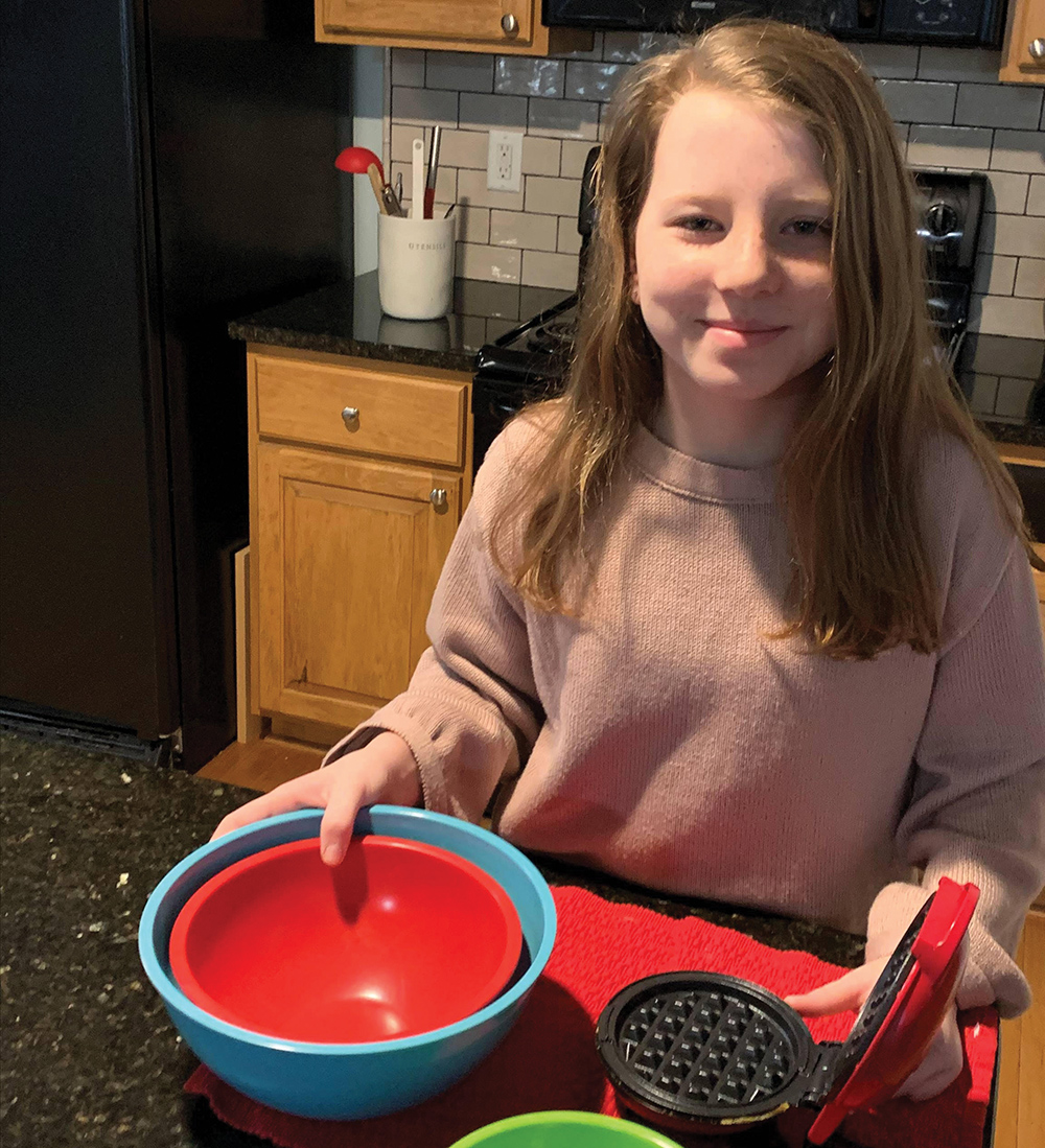 Busy mom teaches daughter how to cook as part of homeschooling