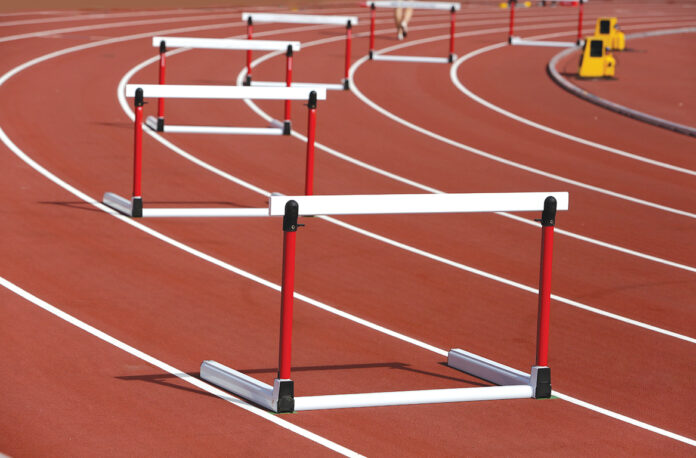 Hurdles on competition background