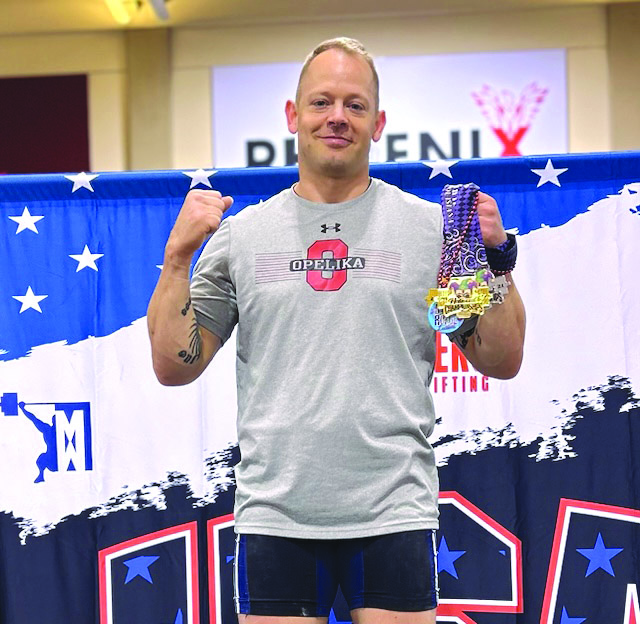 OMS history teacher wins fourth weight lifting national championship