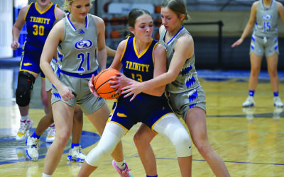 Trinity boys win, girls fall in holiday round robin