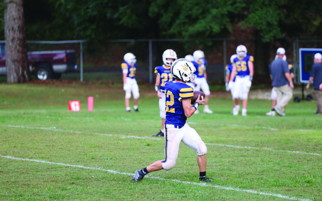 Trinity drops tough contest in season opener